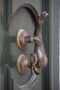 Ornate doorhandle depicting a dolphin. Royalty Free Stock Photo
