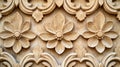 An ornate floral carving design on a textured beige background Royalty Free Stock Photo