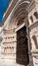 Ornate front gate of the rebuilt Romanesque basilica di Santa Maria di Collemaggio in L\'Aquila, Italy