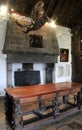 Ornate furniture,portraits and hanging sculpture inside one of the many rooms of Bunratty CastleCounty