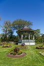 Ornate Gazebo in Green Garden Under Blue Sky