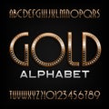 Ornate gold alphabet font. Art deco golden letters and numbers with diamond gemstones. Royalty Free Stock Photo