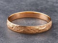 Ornate gold bangle bracelet with intricate engraved pattern Royalty Free Stock Photo