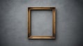 Ornate Gold Picture Frame Hanging on Textured Gray Wall empty frame gold frame Royalty Free Stock Photo