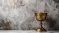 Ornate Golden Chalice on Textured Marble Background for Religious Ceremony.