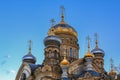 Ornate golden domes and crosses of the Russian Orthodox Church of the Assumption of Mary in Saint Petersburg Russia