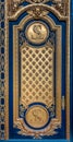 Ornate golden door with fleur de lis pattern at the entrance of Les Invalides in Paris France burial site of Napoleon Bonaparte Royalty Free Stock Photo