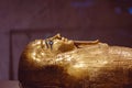 Ornate golden mummy displayed in an exhibit at the Egyptian Museum in Cairo, Egypt