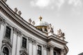 Ornate Hofburg Palace in Vienna, Austria, with detailed domed architecture and sculptures