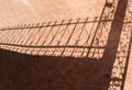 Tile floor and iron fence shadow Royalty Free Stock Photo