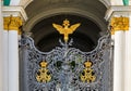 Ornate iron gate of Winter Palace Hermitage in Saint Petersburg, Russia with Russian coat of arms of imperial double headed eagle