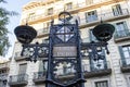 Ornate iron sign and lantern of the Plaza San Pedro square in Barcelona, Catalonia, Spain