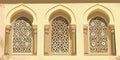 Ornate islamic window design with intricate geometric patterns and arched architecture Royalty Free Stock Photo