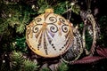 Ornate jeweled Art Deco Christmas Ornament - Close up and hanging from tree