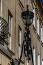 Ornate lamp in front of a Georgian building in Bath, England