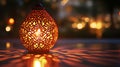 Ornate lantern casting patterned shadows on a dark surface with bokeh in background