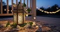 Ornate lantern illuminated on a deck with string lights at dusk Royalty Free Stock Photo