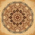 Ornate mandala and zodiac circle with horoscope signs on aged paper background Royalty Free Stock Photo