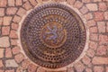 Ornate manhole cover with Bohemian coat of arms lion