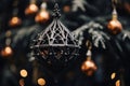 an ornate metal ornament hanging from a christmas tree