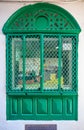 Ornate old carved window in a traditional Moroccan house Royalty Free Stock Photo