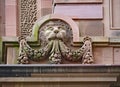 An ornate old stone lion carving