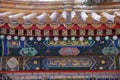 An ornate painted ceiling on a building in the Forbidden City in Beijing Royalty Free Stock Photo