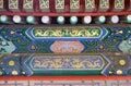 An ornate painted ceiling on a building in the Forbidden City in Beijing Royalty Free Stock Photo