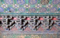 An ornate painted ceiling on a building in the Forbidden City in Beijing