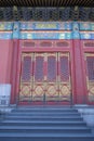 An ornate painted door on a building in the Forbidden City in Beijing Royalty Free Stock Photo