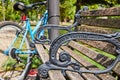 Ornate Park Bench and Bicycle in Urban Green Space Close-Up Royalty Free Stock Photo