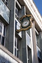 Ornate Public Clock with the company name Marks and Spencer displayed on the exterior of a building