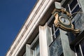 Ornate Public Clock with the company name Marks and Spencer displayed on the exterior of a building