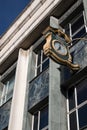 Ornate Public Clock with the company name Marks and Spencer displayed on the exterior of a building