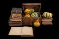 Ornate pumpkin in a old wooden crate and a book. Vegetables and old publications on the dark table