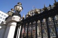 Ornate railings with lamps on lamp posts Royalty Free Stock Photo