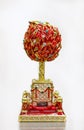 Ornate red and gold Faberge egg souvenir in the official store at Faberge museum for tourists in Saint Petersburg Russia