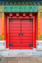 Ornate red wooden door with tile trim and traditional Chinise de Royalty Free Stock Photo