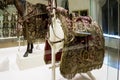 Ornate saddle with gold embroidered red cloth