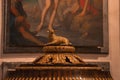 Close-up of ornate sheep statue against painting on wall at La Seu church