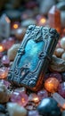 Ornate silver book with blue cover surrounded by crystals and stones Royalty Free Stock Photo