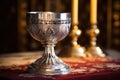 an ornate silver chalice and paten on an altar