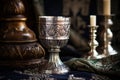 an ornate silver chalice and paten on an altar