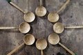 Ornate silver spoons from Mexico on an old wooden table