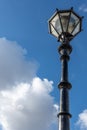 Ornate street lamp and post made of iron metal Royalty Free Stock Photo