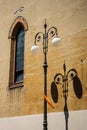 Ornate street lamps in Italy and the shadows they make Royalty Free Stock Photo
