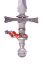 Ornate style dagger handle with red coral bracelet Royalty Free Stock Photo