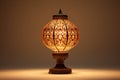 an ornate table lamp against a plain, off-white background