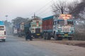Ornate trucks on a polluted street