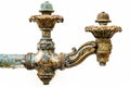 Ornate vintage faucet with distressed patina. Elaborately detailed tap with weathered finish. White background. Concept Royalty Free Stock Photo